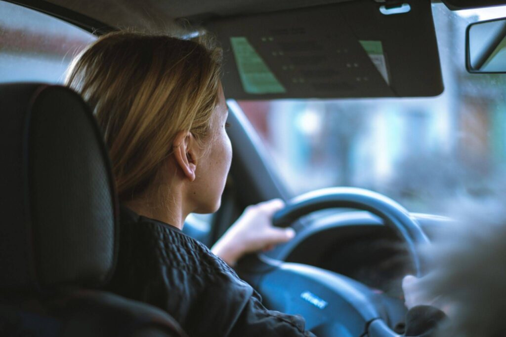 A person practicing for their driving road test.