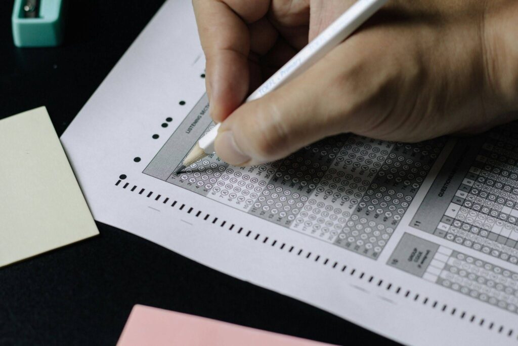 A person filling out road test for their driving license.