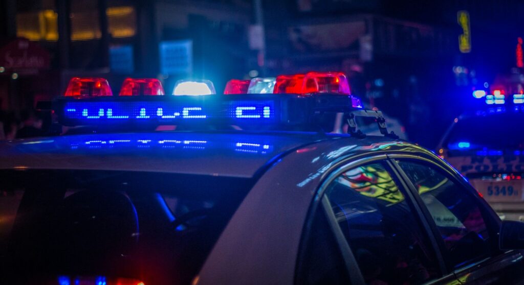 A young driver being stopped by the police.